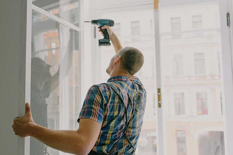 Person fixing window
